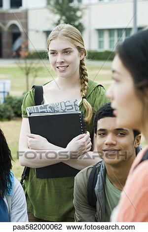 High school student chatting with friends View Large Photo Image Stock Image - High school student chatting with friends. Fotosearch