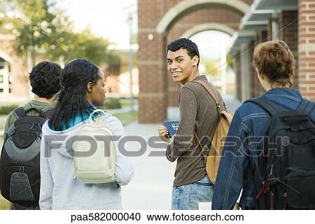 High school student walking with friends View Large Photo Image Stock Image - High school student walking with friends. Fotosearch