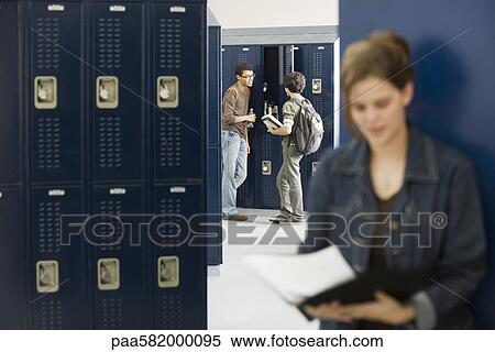 High school students chatting by lockers View Large Photo Image Stock Photography - High school students chatting by lockers. Fotosearch