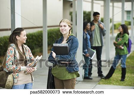 High school students chatting together after school View Large Photo Image Stock Image - High school students chatting together after school. Fotosearch