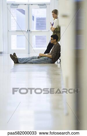High school students hanging out in school corridor View Large Photo Image Stock Image - High school students hanging out in school corridor. Fotosearch