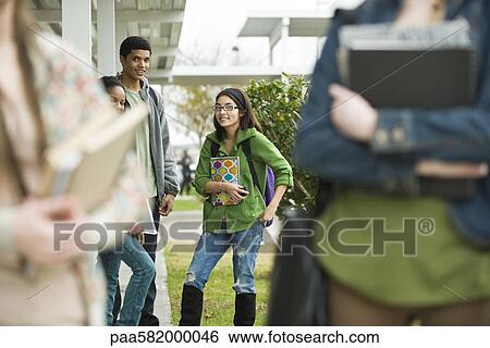 Stock Photograph - High school students hanging out on campus. Fotosearch