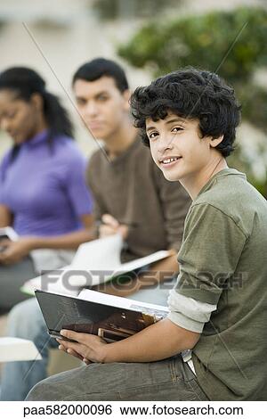 High school students studying outdoors View Large Photo Image Stock Photograph - High school students studying outdoors. Fotosearch