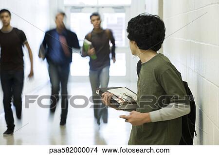 Teenage boy running from bullies View Large Photo Image Picture - Teenage boy running from bullies. Fotosearch