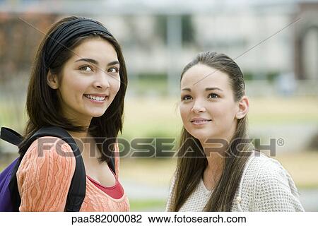 Young woman with friend, portrait View Large Photo Image Stock Image - Young woman with friend, portrait. Fotosearch