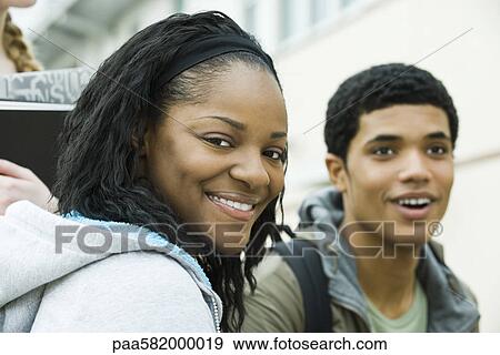 Young woman with friend, portrait View Large Photo Image Stock Photo - Young woman with friend, portrait. Fotosearch