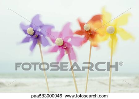 Pinwheels spinning in wind View Large Photo Image Stock Photograph - Pinwheels spinning in wind. Fotosearch