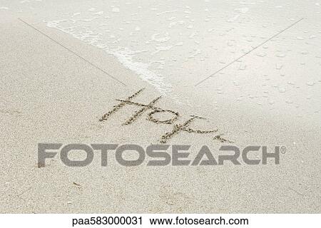 The word "hope" written in the sand at the beach, partially washed away by the tide View Large Photo Image Stock Image - The word "hope" written in the sand at the beach, partially washed away by the tide. Fotosearch