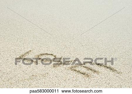 The word "love" written in sand at the beach View Large Photo Image Stock Image - The word "love" written in sand at the beach. Fotosearch