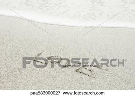 The word "love" written in the sand at the beach View Large Photo Image Stock Photo - The word "love" written in the sand at the beach. Fotosearch