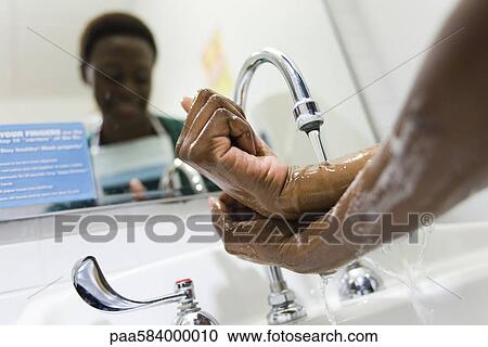 Healthcare worker washing hands View Large Photo Image Stock Image - Healthcare worker washing hands. Fotosearch