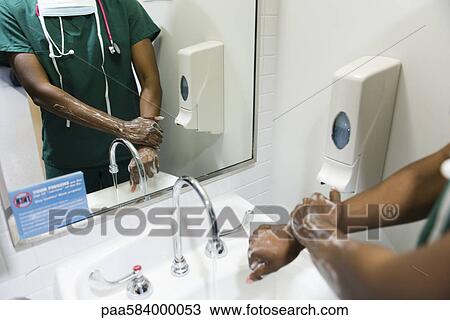 Healthcare worker washing hands View Large Photo Image Stock Image - Healthcare worker washing hands. Fotosearch