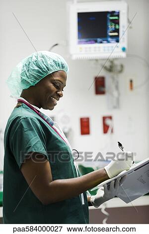 Nurse at work in hospital room View Large Photo Image Stock Photo - Nurse at work in hospital room. Fotosearch
