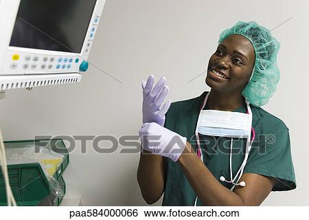 Nurse checking medical equipment monitor View Large Photo Image Stock Photograph - Nurse checking medical equipment monitor. Fotosearch