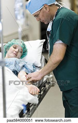 Nurse inserting IV in patient's arm View Large Photo Image Stock Image - Nurse inserting IV in patient's arm. Fotosearch