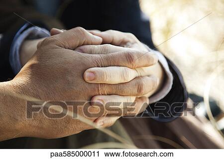 Couple holding hands, cropped View Large Photo Image Stock Image - Couple holding hands, cropped. Fotosearch