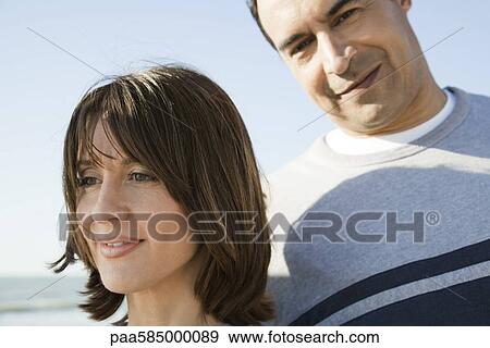 Couple together outdoors, portrait View Large Photo Image Stock Photo - Couple together outdoors, portrait. Fotosearch