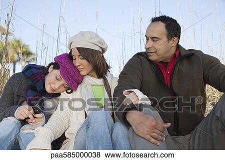 Stock Photo - Family together outdoors. Fotosearch