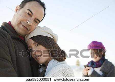 Mature couple embracing outdoors View Large Photo Image Stock Image - Mature couple embracing outdoors. Fotosearch