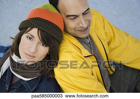 Stock Image - Mature couple relaxing together outdoors. Fotosearch