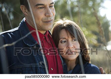 Mature couple relaxing together outdoors, portrait View Large Photo Image Stock Image - Mature couple relaxing together outdoors, portrait. Fotosearch