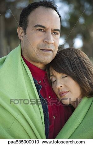 Mature couple sharing blanket outdoors, portrait View Large Photo Image Stock Image - Mature couple sharing blanket outdoors, portrait. Fotosearch