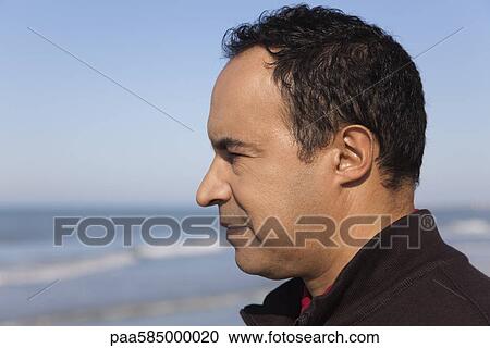 Mature man looking at the ocean, profile View Large Photo Image Stock Image - Mature man looking at the ocean, profile. Fotosearch