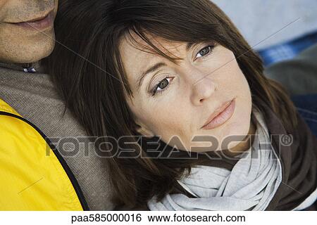 Mature woman resting head on husband's chest, portrait View Large Photo Image Stock Photograph - Mature woman resting head on husband's chest, portrait. Fotosearch