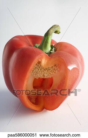 Red bell pepper with section cut out revealing tiny white seeds within View Large Photo Image Stock Image - Red bell pepper with section cut out revealing tiny white seeds within. Fotosearch