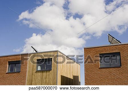 Apartment buildings with solar panels View Large Photo Image Stock Image - Apartment buildings with solar panels. Fotosearch