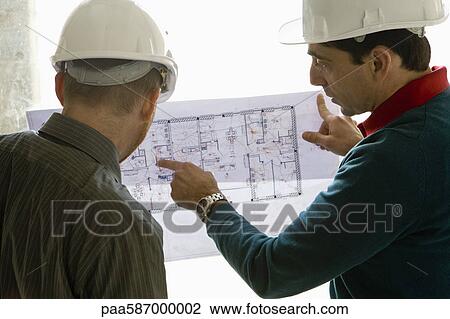 Building contractor explaining blueprint View Large Photo Image Stock Image - Building contractor explaining blueprint. Fotosearch