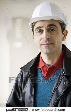 Building contractor in hard hat, portrait View Large Photo Image Stock Image - Building contractor in hard hat, portrait. Fotosearch