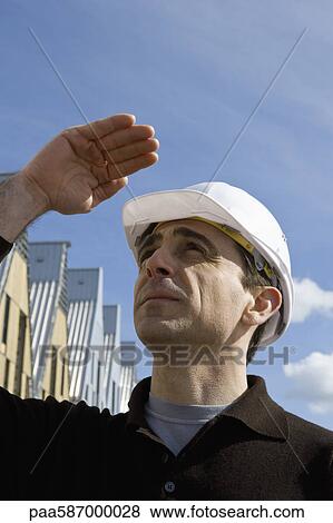 Building contractor in hard hat View Large Photo Image Stock Photo - Building contractor in hard hat. Fotosearch