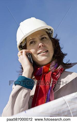 Female architect using cell phone, portrait View Large Photo Image Stock Image - Female architect using cell phone, portrait. Fotosearch