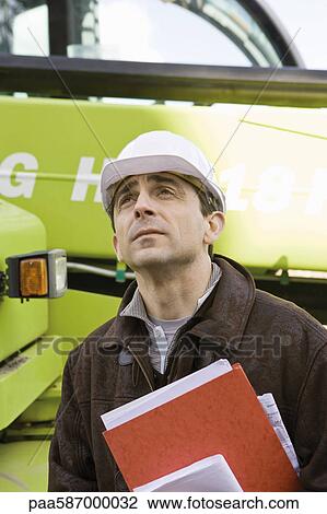 Property developer in hard hat, portrait View Large Photo Image Stock Image - Property developer in hard hat, portrait. Fotosearch