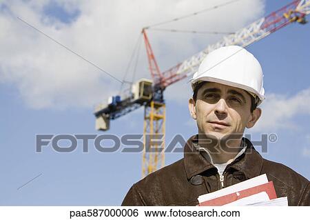 Stock Photograph - Property developer in hard hat, portrait. Fotosearch