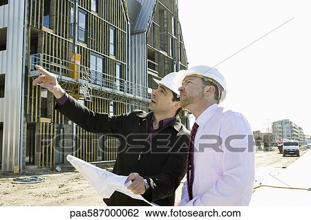 Site foreman explaining to businessman about construction View Large Photo Image Stock Image - Site foreman explaining to businessman about construction. Fotosearch
