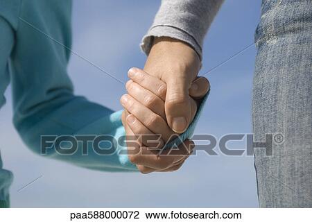 Parent holding child's hand View Large Photo Image Stock Image - Parent holding child's hand. Fotosearch