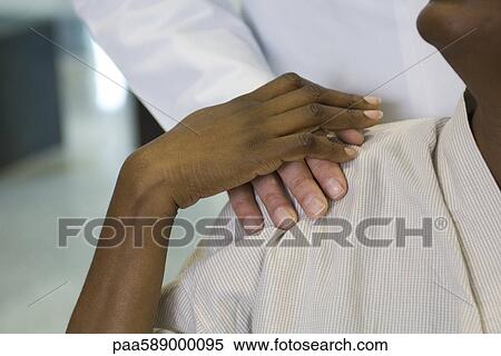 Doctor reassuring patient, cropped View Large Photo Image Stock Photography - Doctor reassuring patient, cropped. Fotosearch
