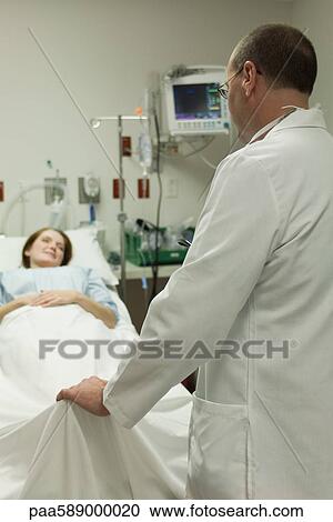 Doctor talking with patient in hospital View Large Photo Image Stock Image - Doctor talking with patient in hospital. Fotosearch