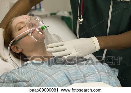 Patient receiving oxygen treatment View Large Photo Image Stock Image - Patient receiving oxygen treatment. Fotosearch