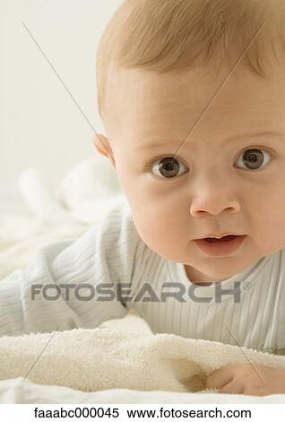 Stock Photography - baby, toddler, infant, brown brown-eyed, brown eyed, curious, inquisitive. Fotosearch