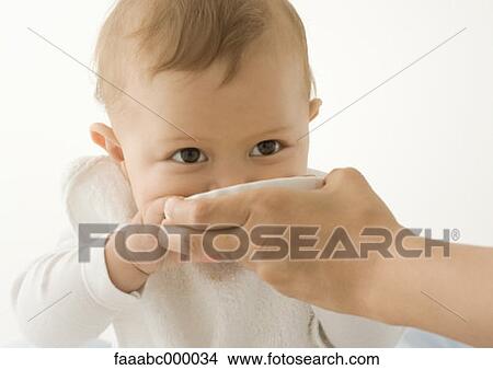 Picture - baby, toddler, infant, eating, feeding, childhood, food and drink. Fotosearch