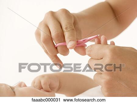 Stock Image - baby, toddler, infant, nail, nails, fingernail, fingernails. Fotosearch