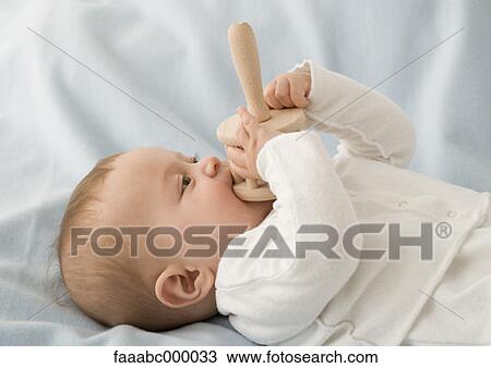 Stock Image - baby, toddler, infant, teething, only one baby, childhood, infancy. Fotosearch