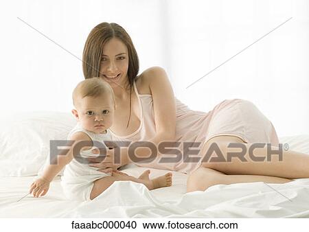 Stock Image - baby, toddler, infant, woman, females, mother. Fotosearch