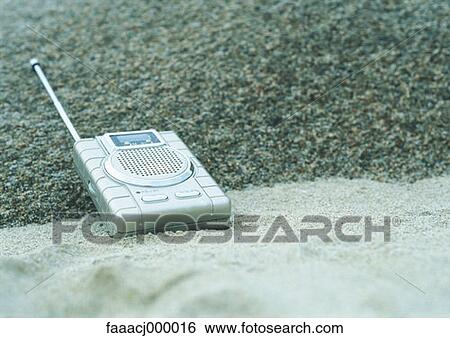Stock Photograph - beach, sand, radio, radios, music, sound, close-up. Fotosearch