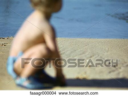 child, children, kid, kids, crouching, sea, beach View Large Photo Image Picture - child, children, kid, kids, crouching, sea, beach. Fotosearch