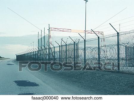 fence, fences, enclosure, wire fence, chain link fence, chainlink fence, road View Large Photo Image Stock Image - fence, fences, enclosure, wire fence, chain link fence, chainlink fence, road. Fotosearch