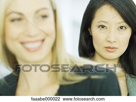 Stock Image - looking at camera, portrait, woman, females, executive, executives, businesswoman. Fotosearch